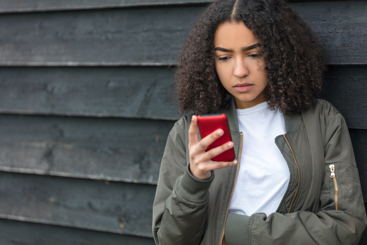 Young girl using phone