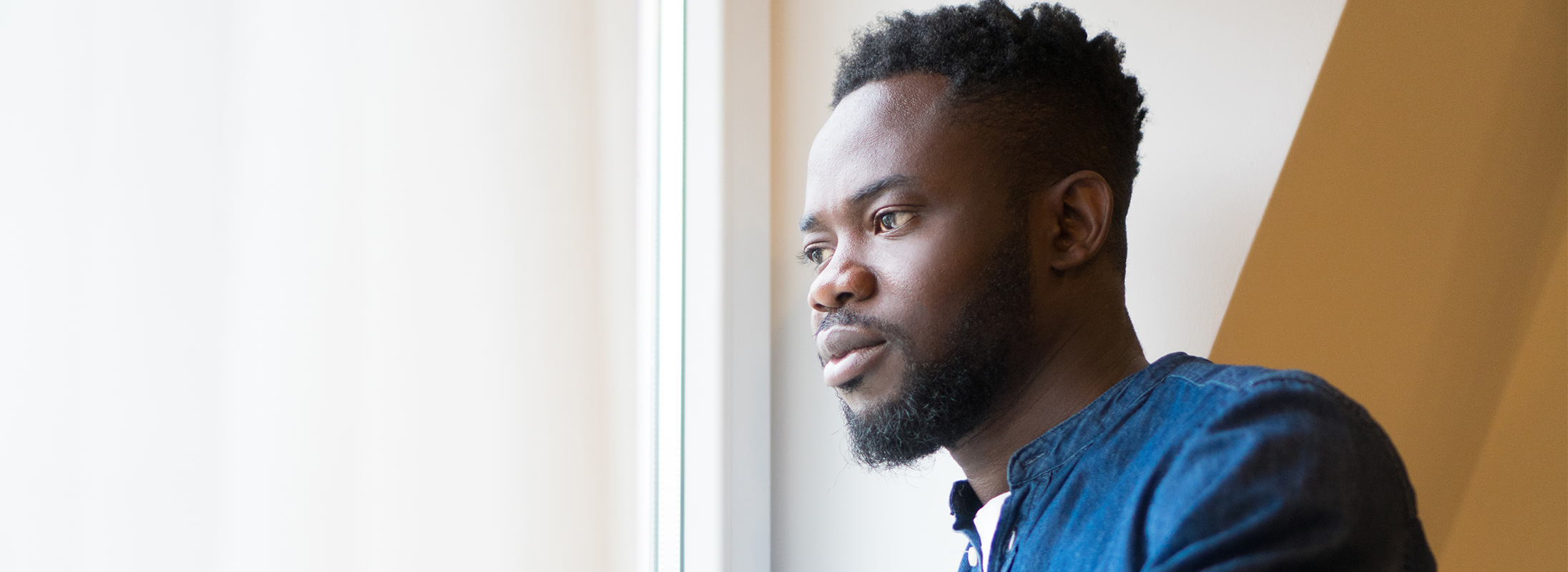 Man looking out of window